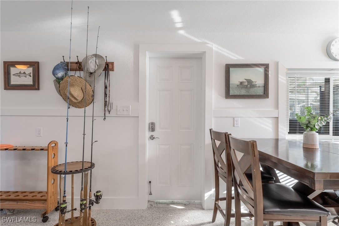 16341 Porto Bello Street Bokeelia, FL 33922 - Photo 2 of 50 a view of a dining room with furniture
