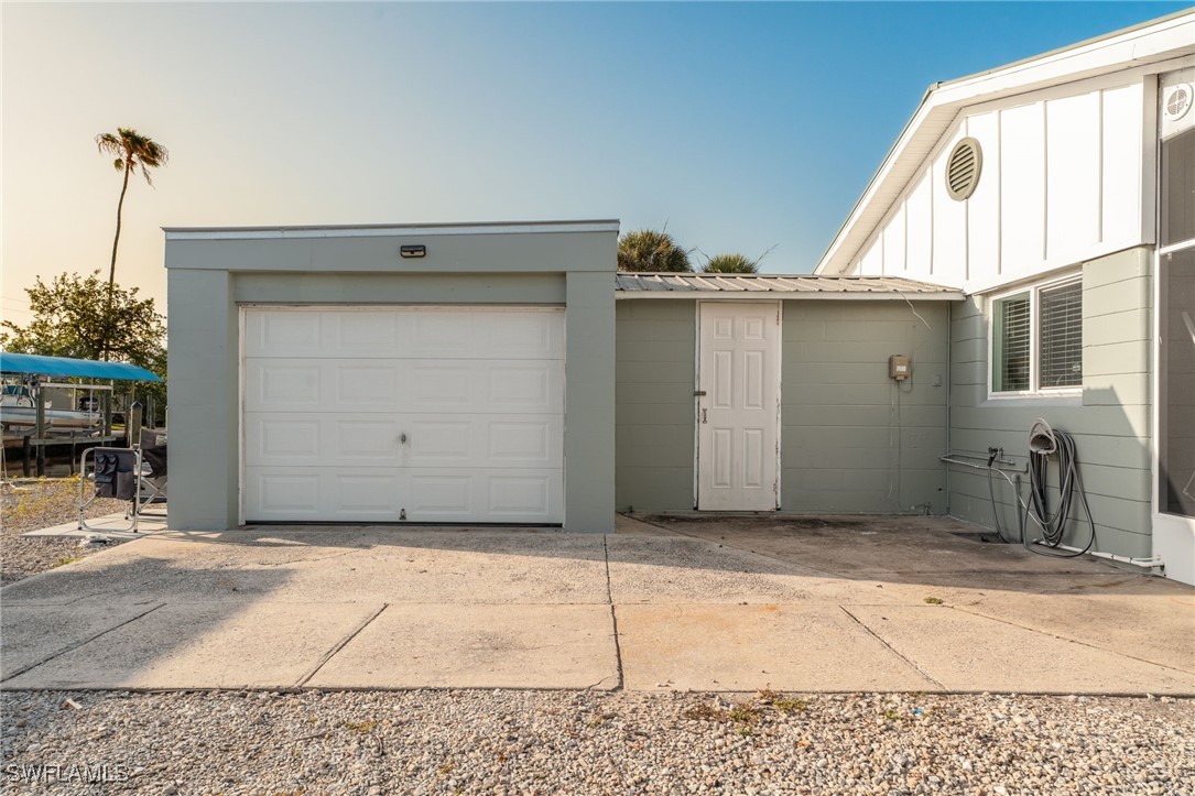 16341 Porto Bello Street Bokeelia, FL 33922 - Photo 21 of 50 a view of a house with a backyard