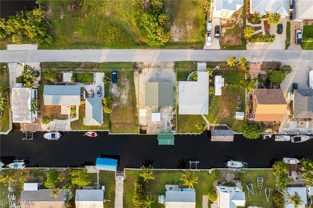 16341 Porto Bello Street Bokeelia, FL 33922 - Photo 29 of 50 an aerial view of a building with outdoor area