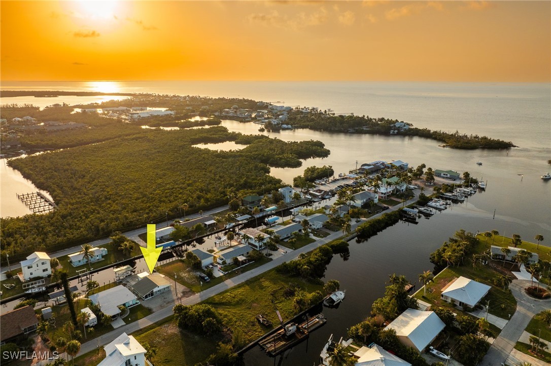 16341 Porto Bello Street Bokeelia, FL 33922 - Photo 30 of 50 an aerial view of ocean and residential houses with outdoor space