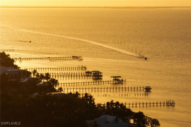 an aerial view of a house with a ocean view