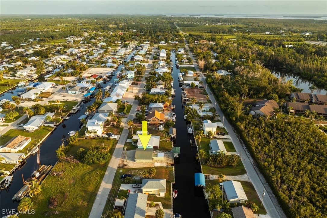 16341 Porto Bello Street Bokeelia, FL 33922 - Photo 40 of 50 an aerial view of residential houses with outdoor space