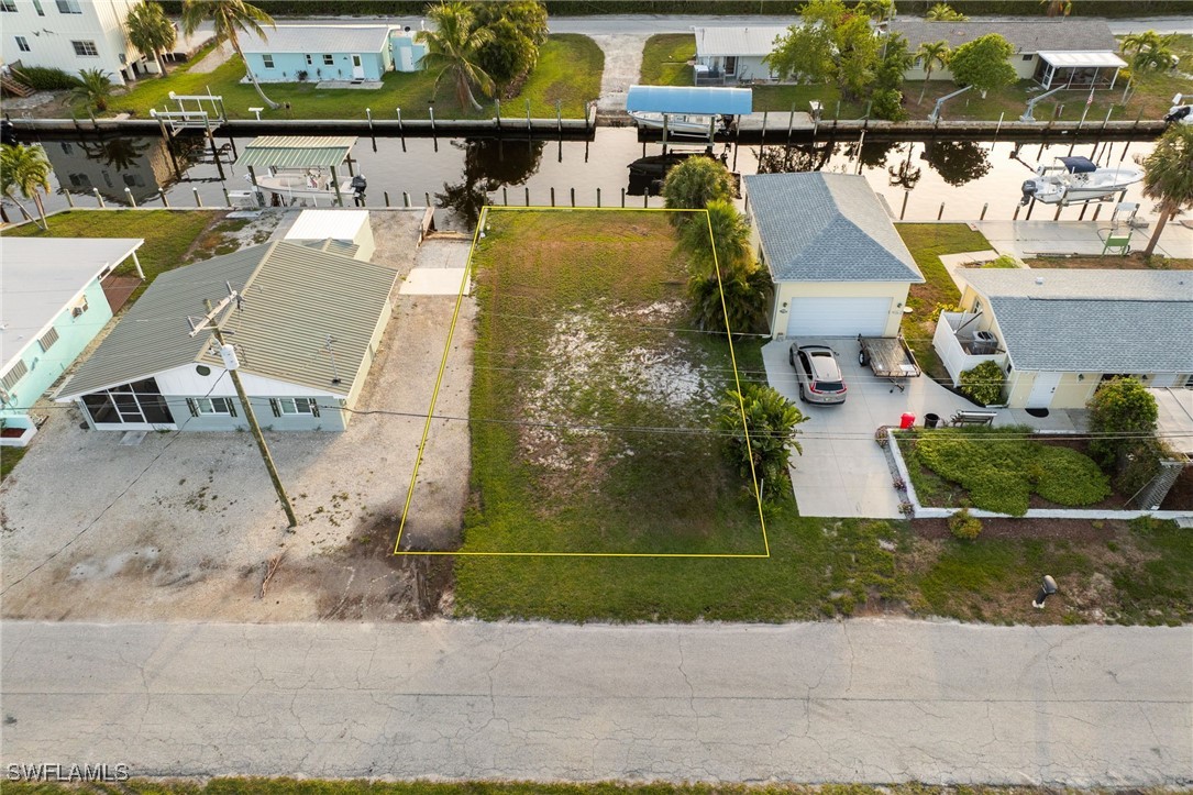 16341 Porto Bello Street Bokeelia, FL 33922 - Photo 50 of 50 an aerial view of a house with a yard