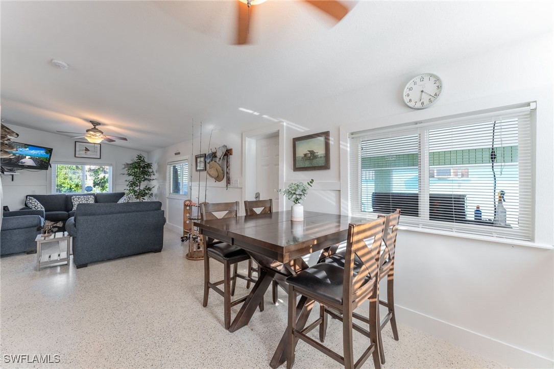 16341 Porto Bello Street Bokeelia, FL 33922 - Photo 8 of 50 a view of a dining room with furniture and a table