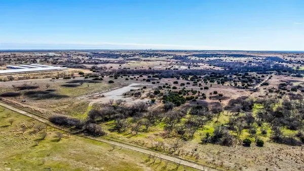 an aerial view of house with yard