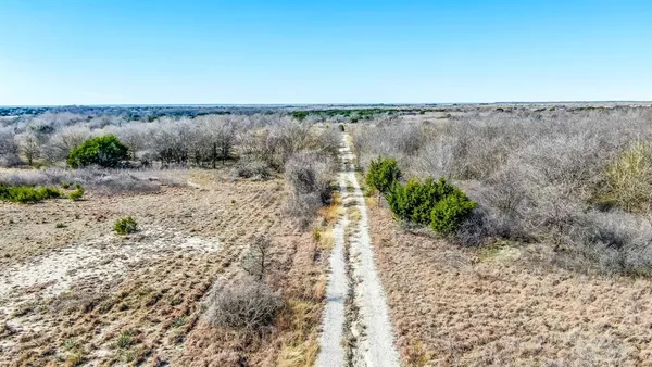 a view of open space with wooden fence