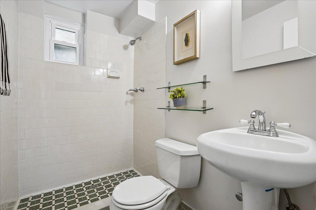 104 Belton Road Silver Spring, MD 20901 - Photo 11 of 56 a bathroom with a sink a toilet and mirror