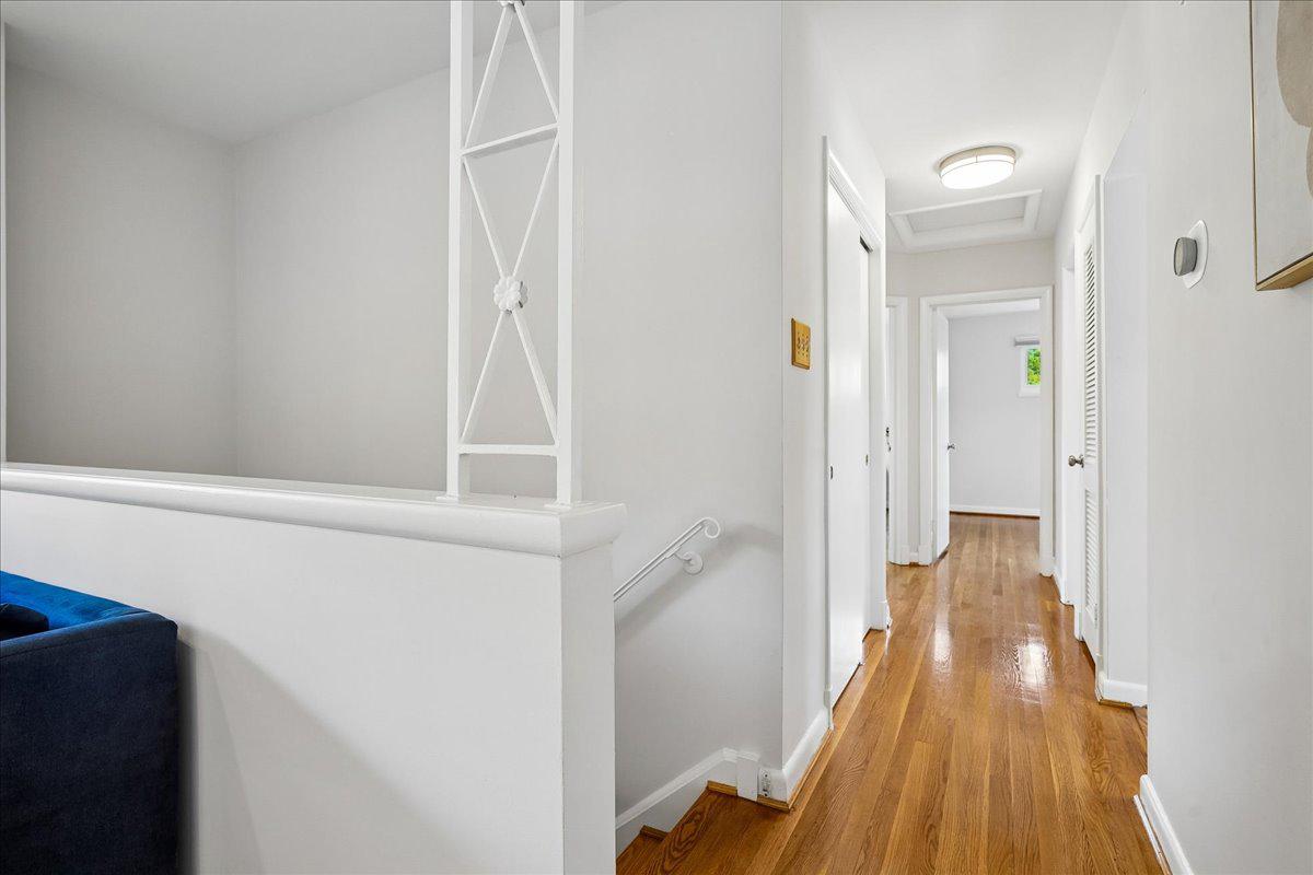 104 Belton Road Silver Spring, MD 20901 - Photo 14 of 56 a view of a hallway with wooden floor and staircase