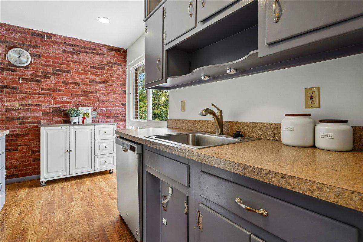 104 Belton Road Silver Spring, MD 20901 - Photo 24 of 56 a kitchen with stainless steel appliances a sink and a stove