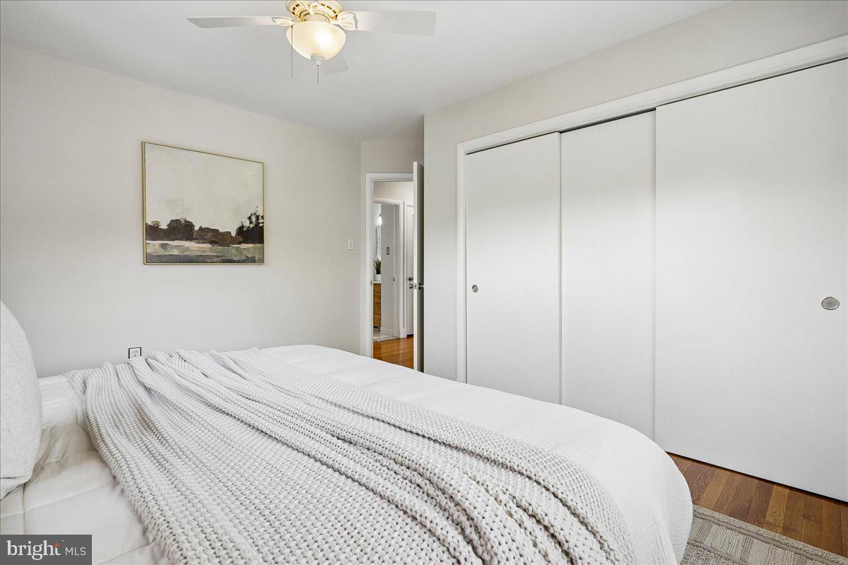 104 Belton Road Silver Spring, MD 20901 - Photo 33 of 56 a bedroom with a bed and a painting on the wall