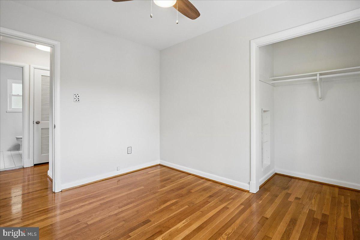 104 Belton Road Silver Spring, MD 20901 - Photo 37 of 56 a view of an empty room with wooden floor