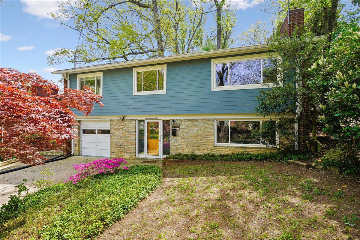 104 Belton Road Silver Spring, MD 20901 - Photo 42 of 56 a view of a house with a yard and a garage