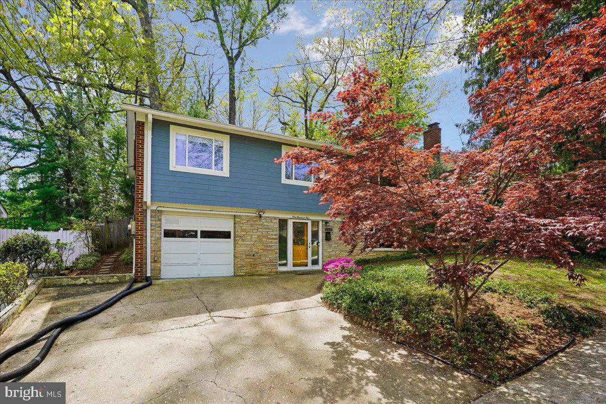 104 Belton Road Silver Spring, MD 20901 - Photo 43 of 56 a view of a house with a yard