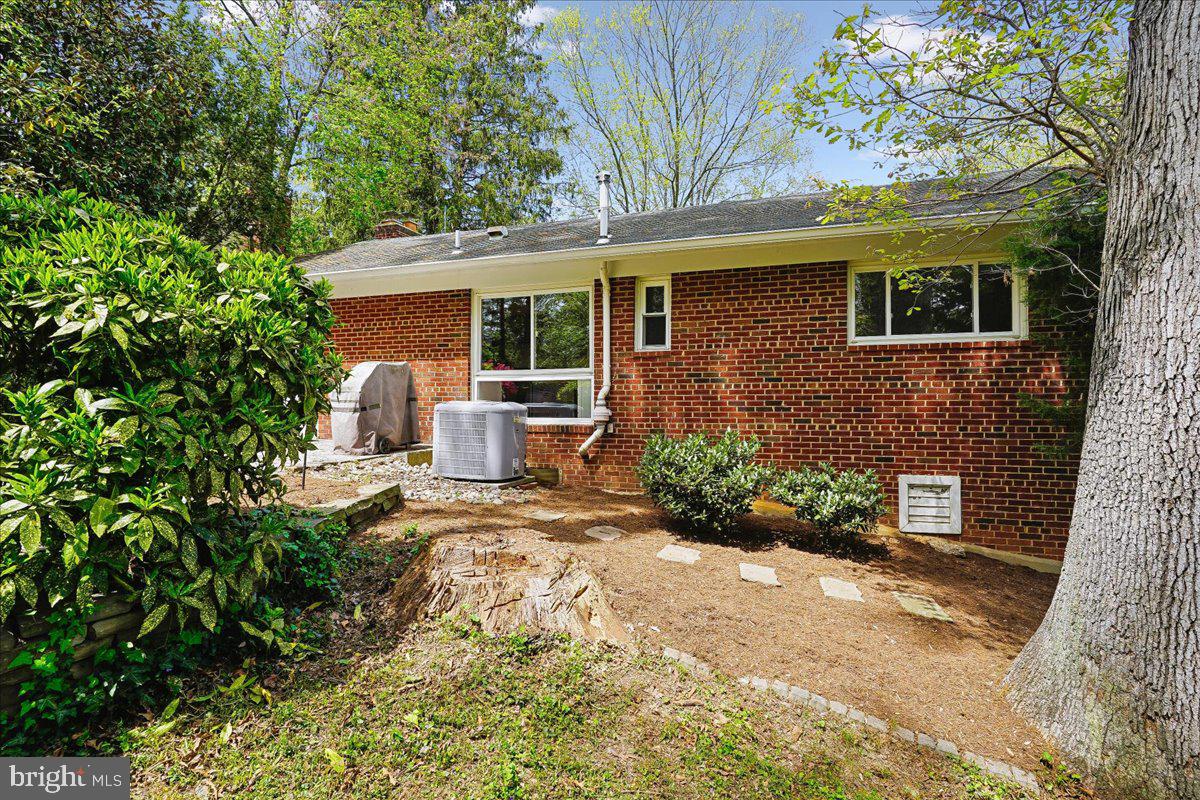 104 Belton Road Silver Spring, MD 20901 - Photo 44 of 56 a front view of a house with a yard and potted plants