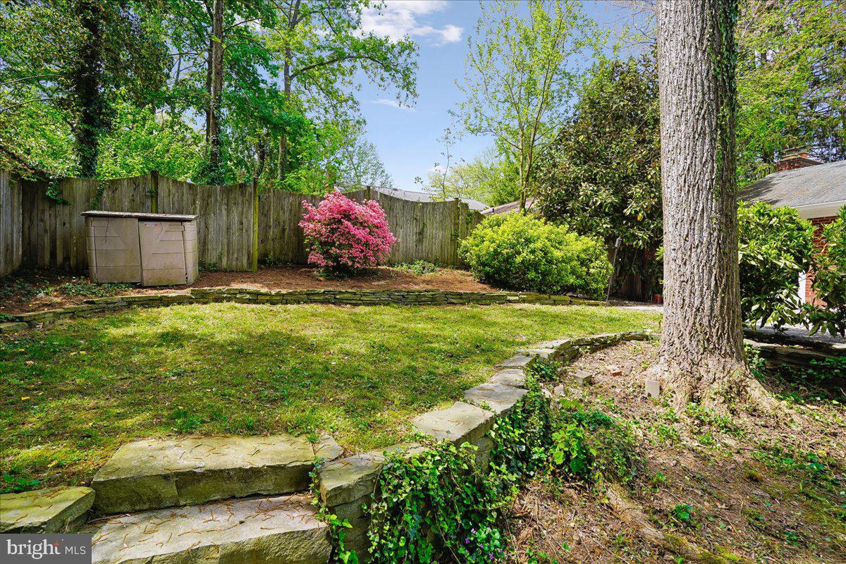 104 Belton Road Silver Spring, MD 20901 - Photo 52 of 56 a backyard of a house with a yard and outdoor seating
