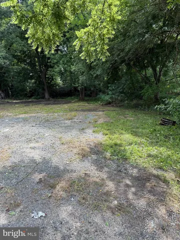 a view of outdoor space with deck and yard