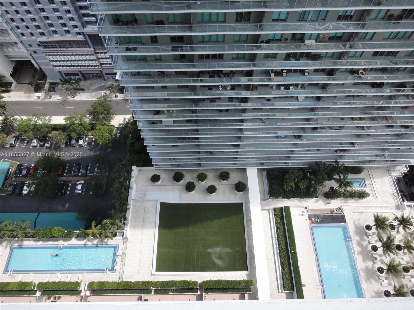 1111 Southwest 1st Avenue, Unit 3415N Miami, FL 33130 - Photo 10 of 11 a picture of a bathroom with a sink and a mirror