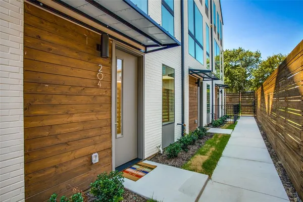 a view of a pathway besides a house