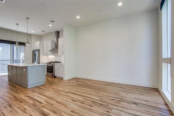 a view of kitchen with wooden floor