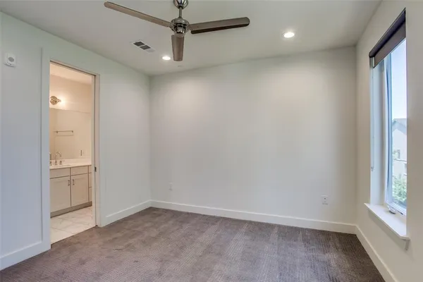 an empty room with a empty space and windows