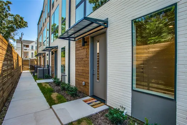a view of a pathway of a house with a porch
