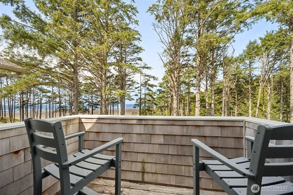 a view of a chairs and table in the balcony