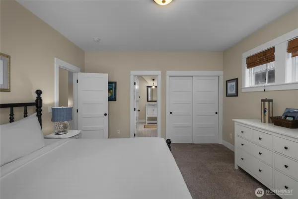 a bedroom with a bed and a cabinets