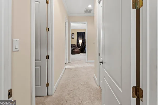 a view of a livingroom from a hallway