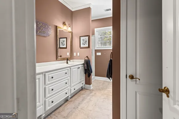 a view of bathroom with dual sinks