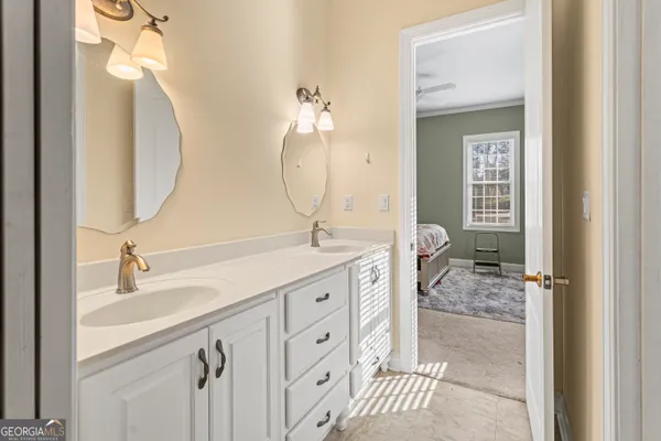 a spacious bathroom with a double vanity sink mirror and