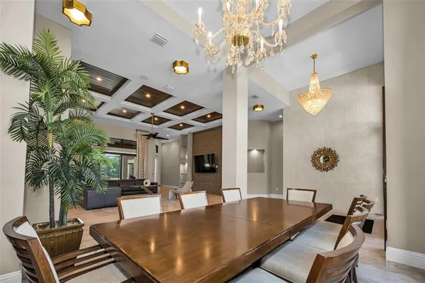 a living room with furniture and a view of the lobby