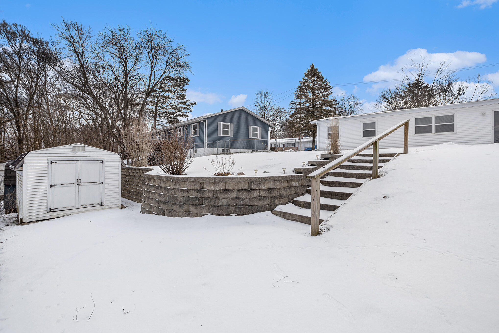 34 South New Moon Terrace Springfield, MI 49037 - Photo 16 of 17 shed and retaining wall