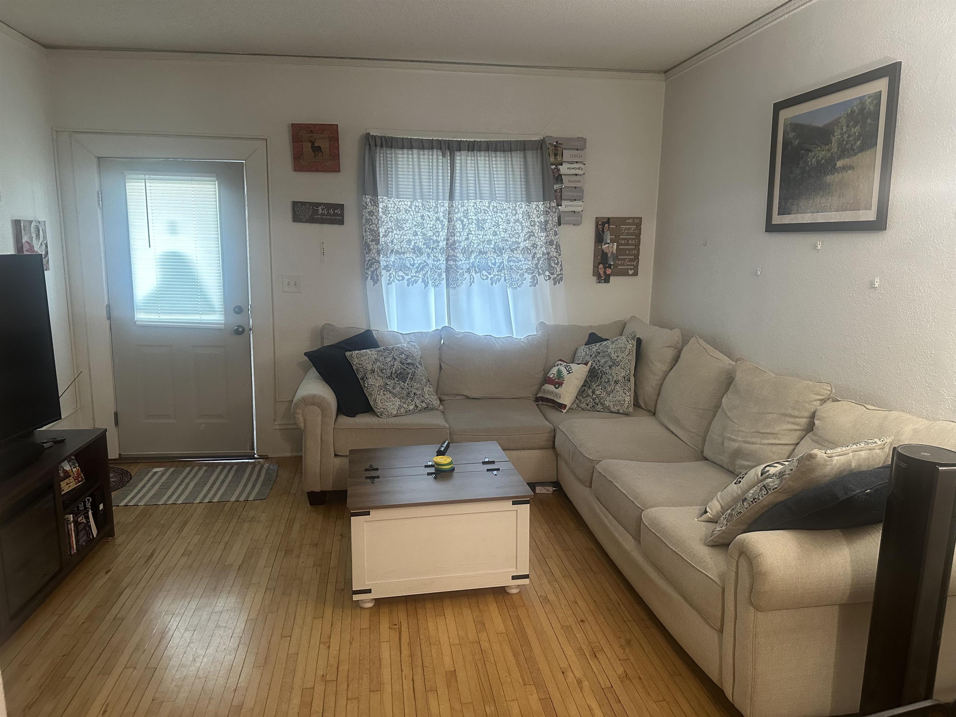 3512 Belknap Street Superior, WI 54880 - Photo 11 of 24 Living area featuring hardwood / wood-style floors and ornamental molding