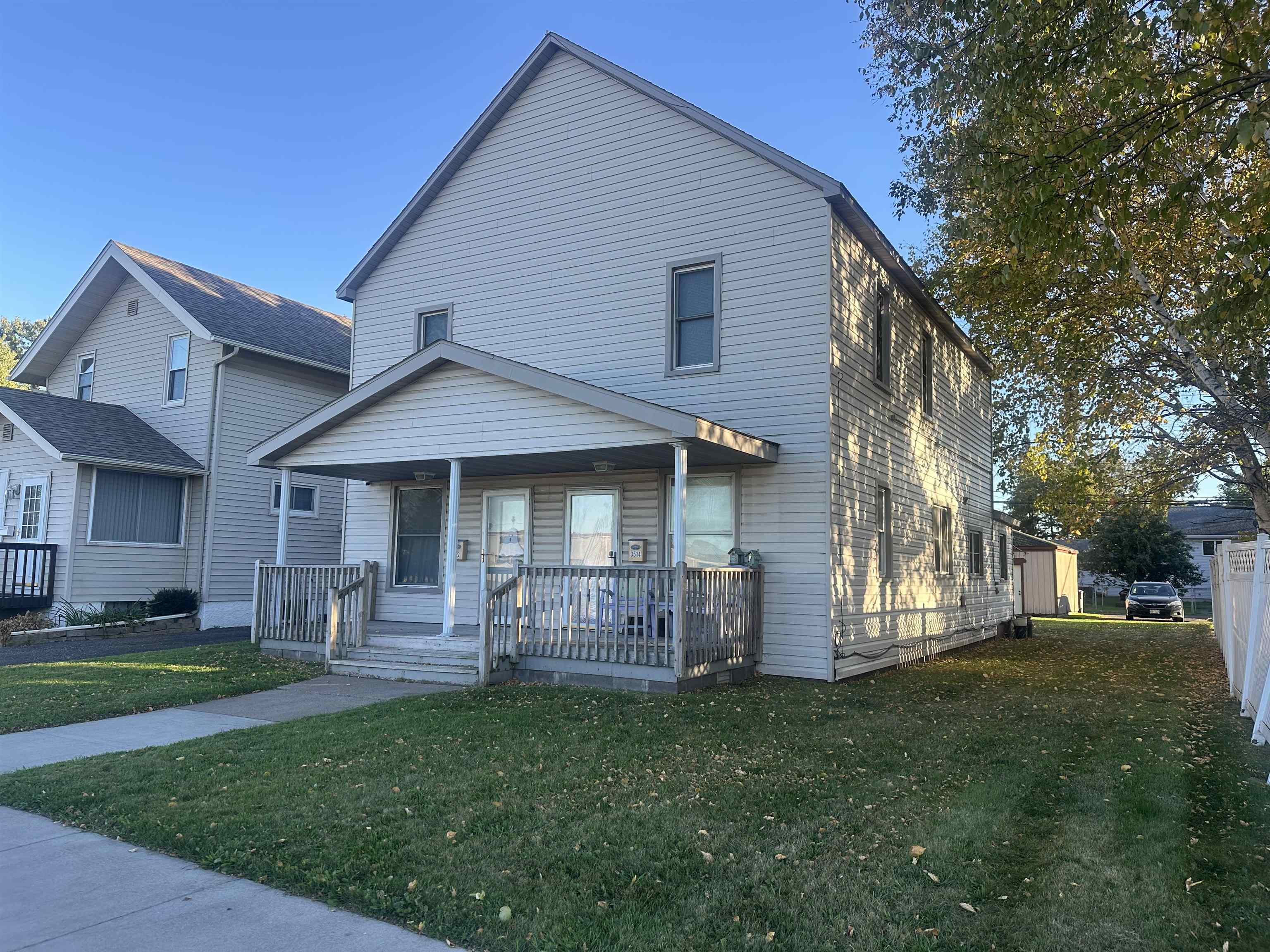 3512 Belknap Street Superior, WI 54880 - Photo 2 of 24 View of front of property featuring a front lawn and covered porch