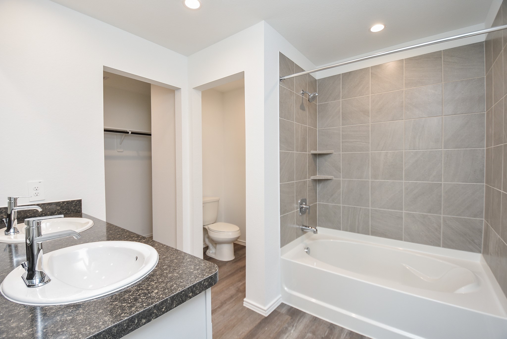 5718 Sycamore Glen Dr Spring Spring, TX 77373 - Photo 17 of 33 a bathroom with a granite countertop sink and a mirror