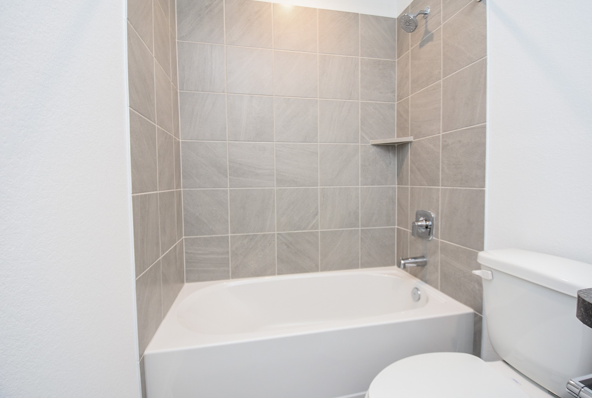 5718 Sycamore Glen Dr Spring Spring, TX 77373 - Photo 26 of 33 a white bath tub sitting next to a white toilet