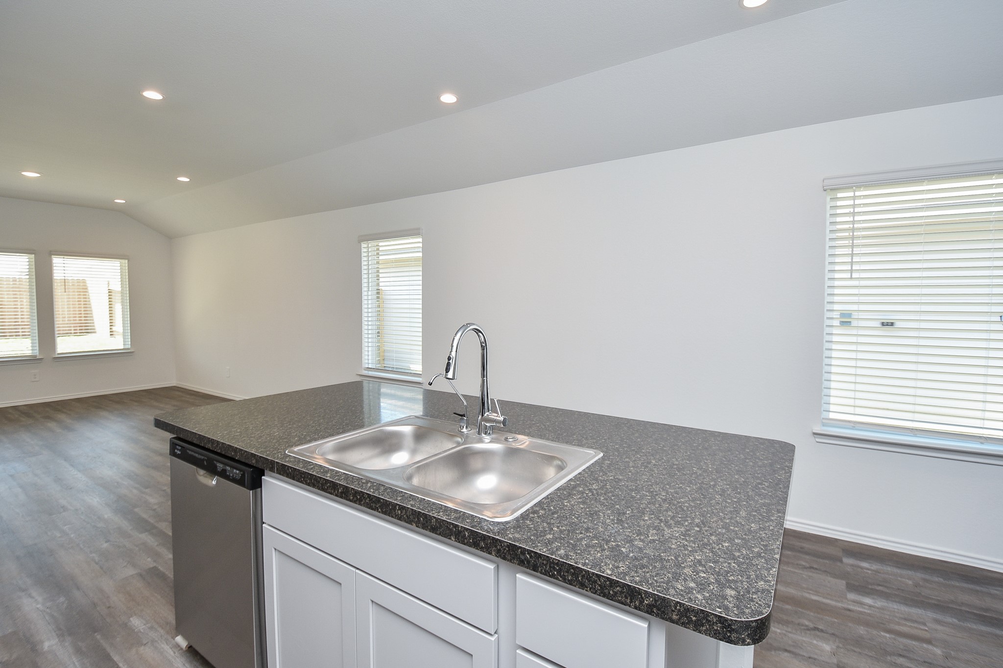 5718 Sycamore Glen Dr Spring Spring, TX 77373 - Photo 9 of 33 a bathroom with a granite countertop sink a mirror and wooden floor