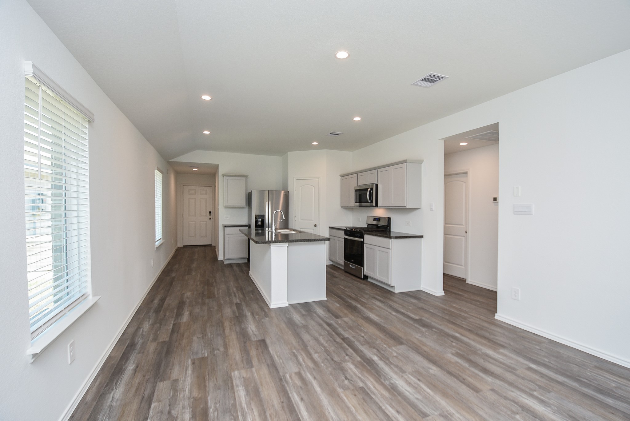 5718 Sycamore Glen Dr Spring Spring, TX 77373 - Photo 10 of 33 a view of kitchen with wooden floor