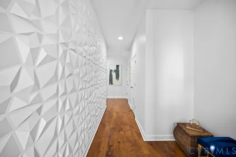 a view of a hallway with seating space