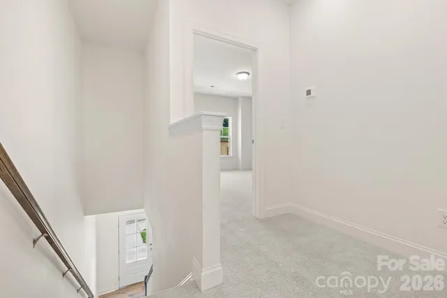 a view of an entryway with white walls
