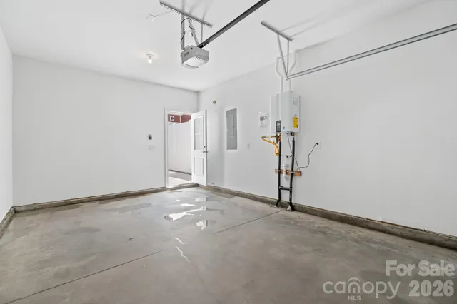 a view of walk in closet with clothes