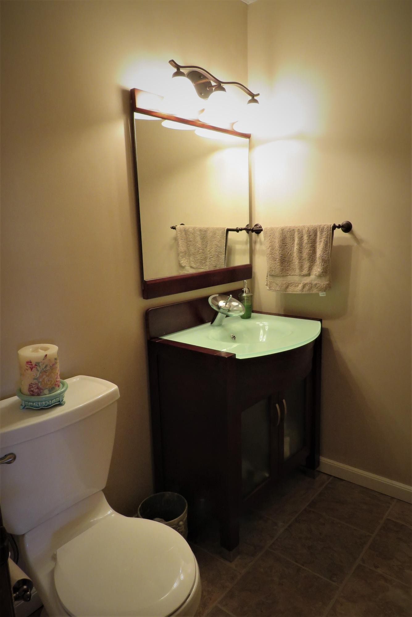 18 Clark Place Oak Ridge, TN 37830 - Photo 11 of 20 a bathroom with a sink a toilet and mirror