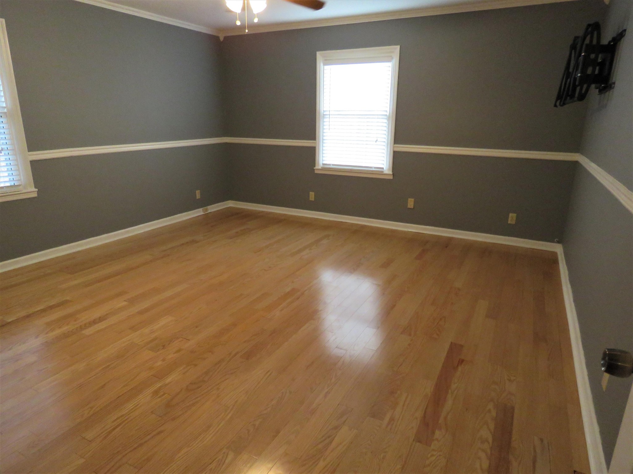 18 Clark Place Oak Ridge, TN 37830 - Photo 12 of 20 an empty room with wooden floor and windows