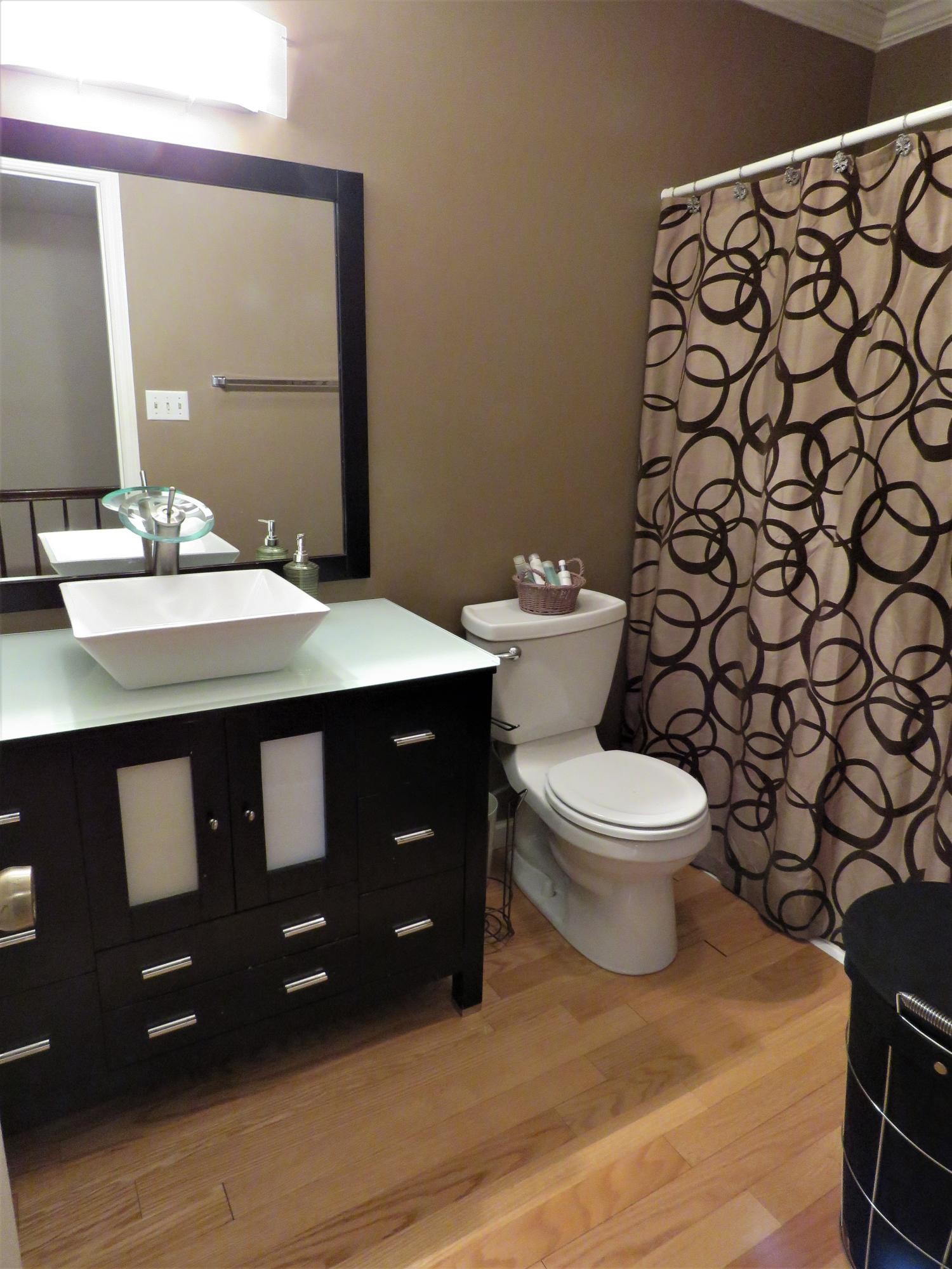 18 Clark Place Oak Ridge, TN 37830 - Photo 17 of 20 a bathroom with a granite countertop toilet and a sink