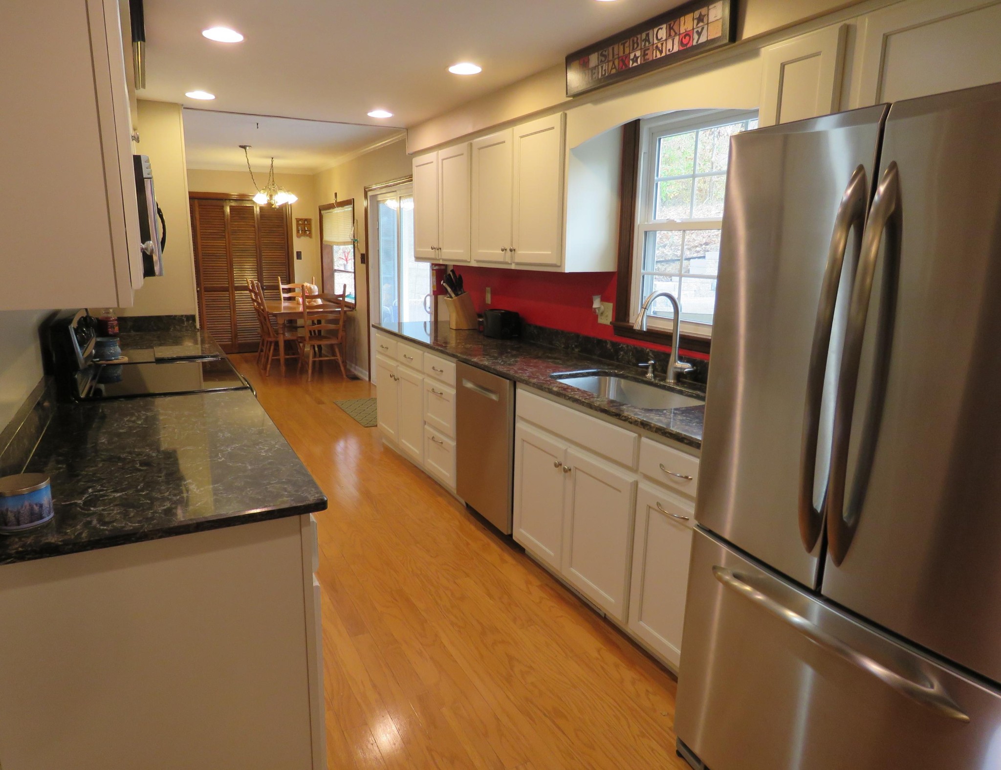 18 Clark Place Oak Ridge, TN 37830 - Photo 5 of 20 a kitchen with stainless steel appliances granite countertop a refrigerator a stove and a sink