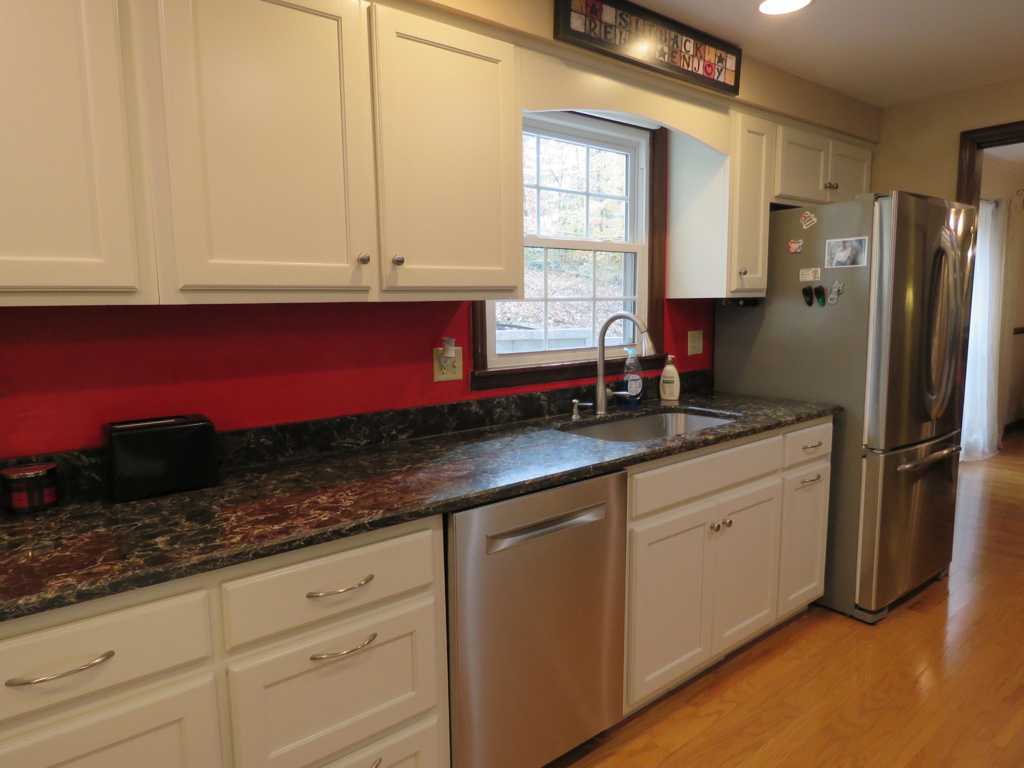18 Clark Place Oak Ridge, TN 37830 - Photo 7 of 20 a kitchen with granite countertop white cabinets and stainless steel appliances