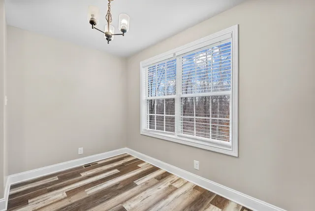 a view of a room with a large window