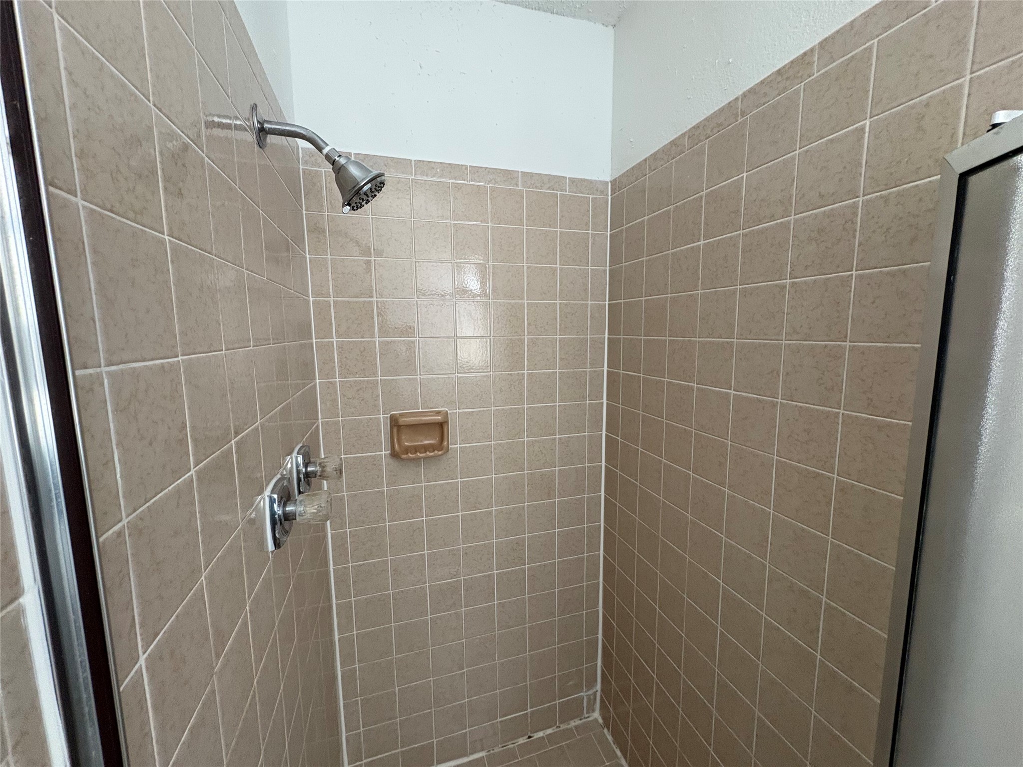 9201 Simmons Road, Unit 119 Austin, TX 78759 - Photo 20 of 22 Full bathroom featuring a shower stall