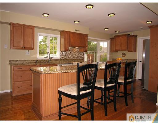 25 Tripplet Road Somerset, NJ 08873 - Photo 4 of 10 a view of a dining room with furniture and wooden floor