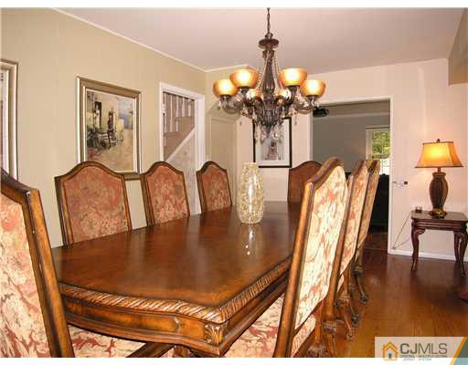 25 Tripplet Road Somerset, NJ 08873 - Photo 6 of 10 a view of a dining room with furniture and wooden floor